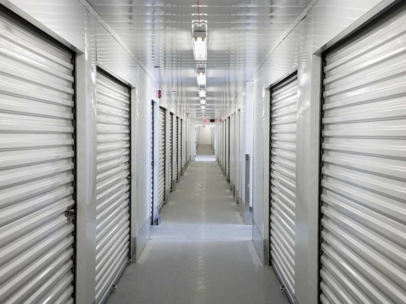 A perspective view down a corridor of storage units